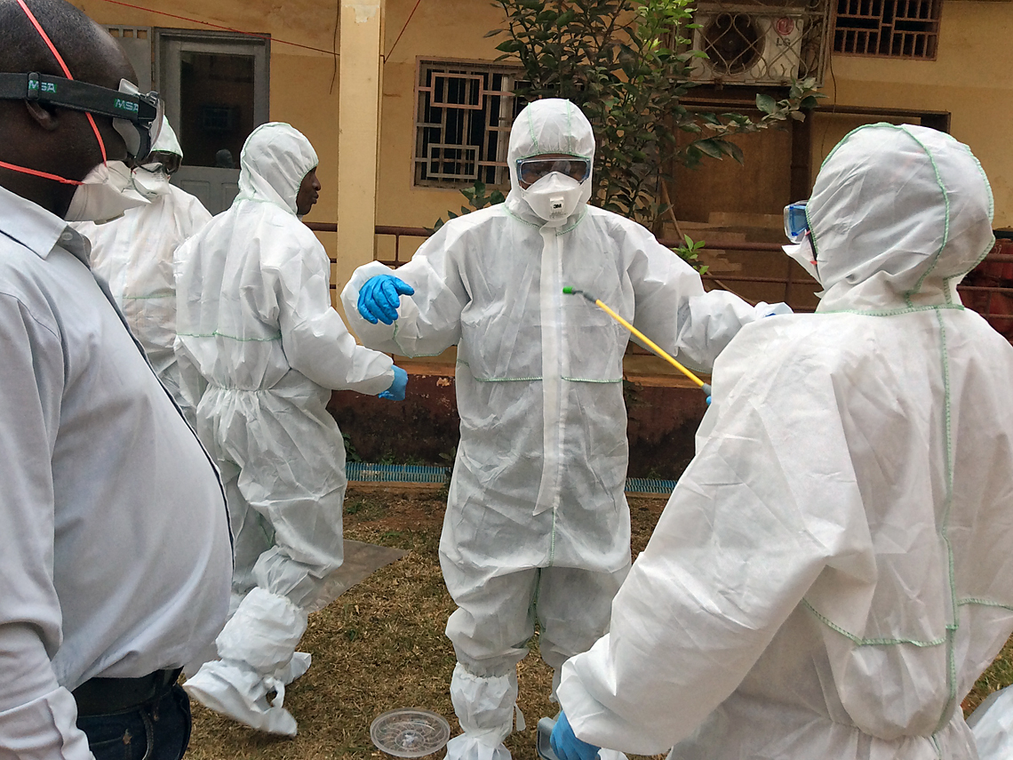 From Lab Coats to Hazmat Suits: IAEA Trains Scientists to Work Safely With  Ebola | IAEA