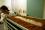 Fly eggs are "seeded" in trays filled with food for the larvae to feast on.  This batch of eggs, sprayed onto white tissue paper, is wheeled to the larvae room for hatching.