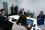 IAEA Director General Rafael Mariano Grossi (seated, right) gives a daily briefing to the IAEA team at the Scottish Event Campus, during the UN Climate Change Conference (COP26) in Glasgow, Scotland, the United Kingdom, November 2021. 