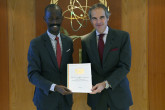 Mr. Garspard Liyoko Mboyo, President, National Nuclear Regulatory Cell, Chairman, Commission on Nuclear Energy, deposits the instrument of ratification on the Amendment to the Convention on the Physical Protection of Nuclear Material (A/CPPNM) of the Republic of Congo to IAEA Director General Rafael Mariano Grossi, at the Agency headquarters in Vienna, Austria. 1 November 2023