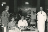 Four participants (maybe also staff members) during the panel inside the conference room. 
(IAEA Archives/Credit: Photo Ellinger)