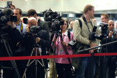Members of the media try to get the best view of IAEA Director General Mohamed ElBaradei at an official press conference following his win of the Nobel Peace Prize. (Vienna International Centre, Vienna Austria, 7 October 2005) 