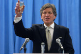 Deputy Director General David Waller leads staff in a toast. The Nobel Committee recognized the IAEA&acute;s work as being "of incalculable importance" to global peace and security. (Photo credit: D. Calma/IAEA)