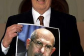 Chairman of the Norwegian Nobel Committee Ole Danbolt Mjoes holds a picture of IAEA Director General Mohamed ElBaradei, winner of the 2005 Nobel Peace Prize, in Oslo, Norway, October 7, 2005. The IAEA and its leader won the 2005 Nobel Peace Prize on Friday for their efforts to limit the spread of atomic weapons. The award ceremony will be held on December 10. (REUTERS/Erlend Aas /Scanpix) 