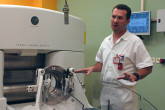 Photo 1 of 11 : In health care, the double-edged sword of radiation can be used to fight cancer and scope out signs of disease... under strict controls and in the right hands. In Prague, Czech Republic, Dr. Josef Novotn&yacute;,  a medical physicist, works to make sure that patients are correctly and safely treated at Na Homolce Hospital. He checks and calibrates equipment, and conducts training in radiation safety under an IAEA-supported project.