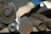 At a machine tool factory, an IAEA inspector takes smear samples. Photo Credits: Pavlicek/IAEA