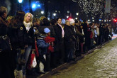 10 December 2005 | The procession gathers outside the laureate's hotel, to wait and watch them wave from the balcony.