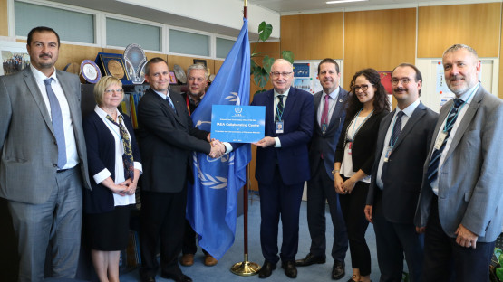 Aldo Malavasi, Deputy Director General and Head of the Department of Nuclear Sciences and Applications, hands over the Collaborating Centre redesignation plaque to Dr. Attila Nagy, Deputy Director of Hungary's National Food Chain Safety Office