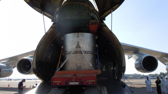 Truck with container of HEU fuel is driving into the cargo plane for repatriation to Russia.
