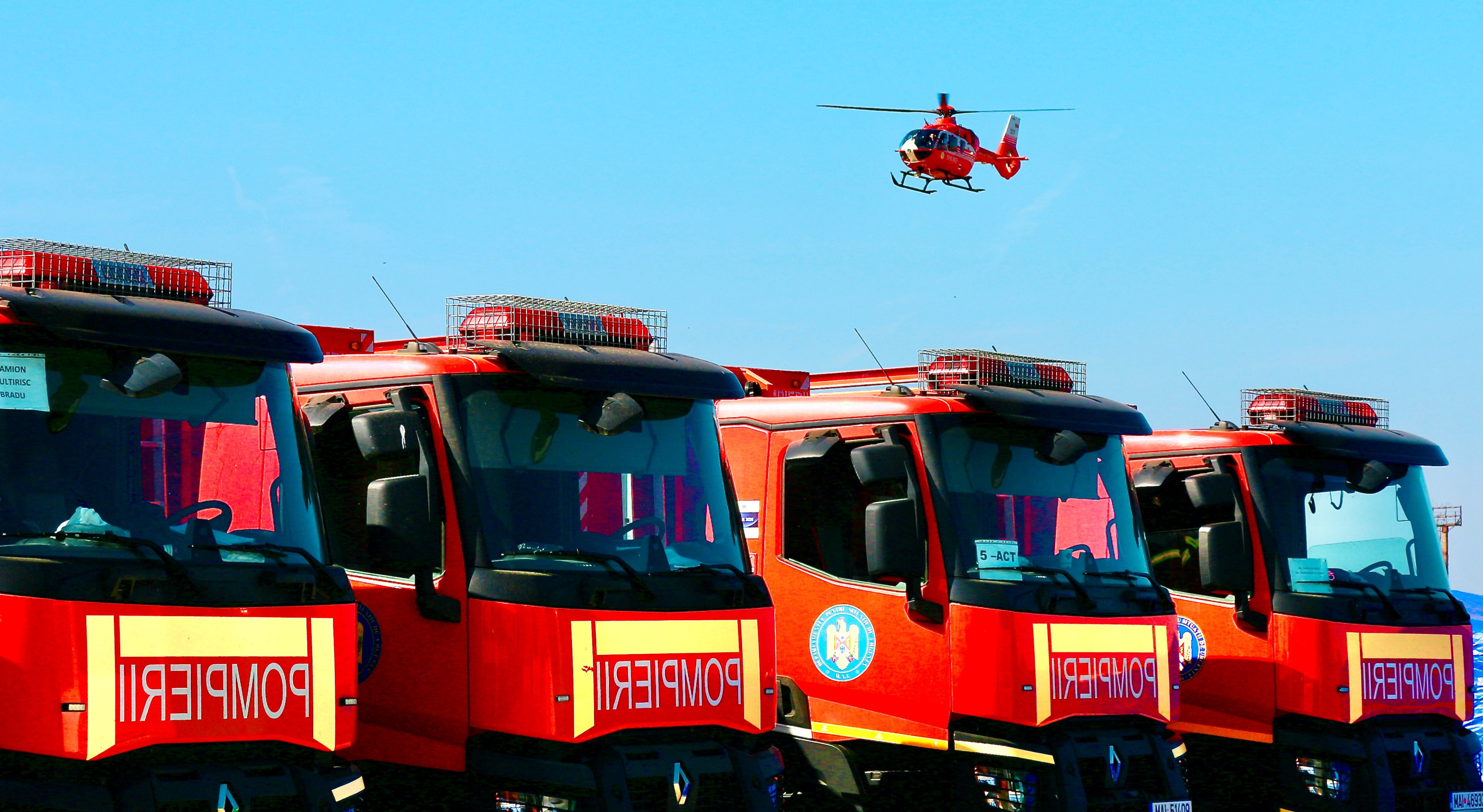 A row of emergency response fire trucks stand ready for action as part of the national preparedness exercise “Valahia” in Romania in October 2023.